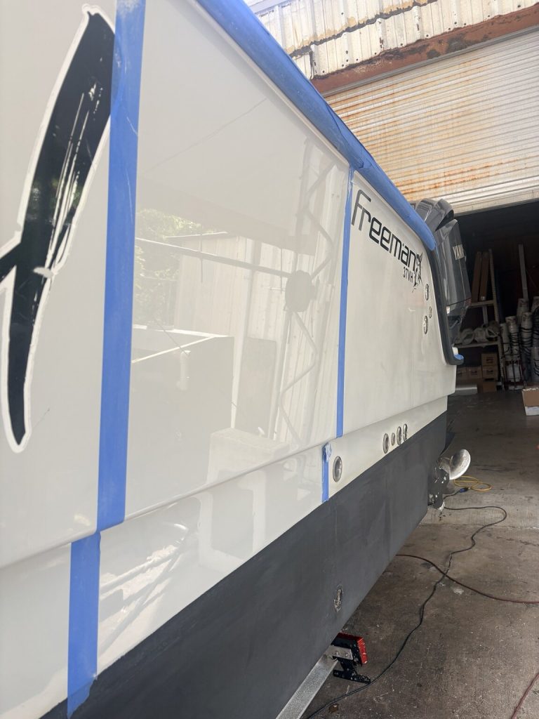 Freeman alongside boatyard equipment during restoration