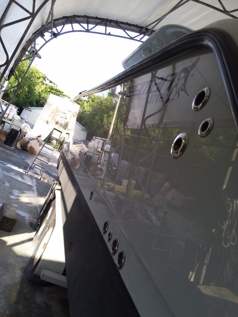 Freeman hull reflecting the boatyard during restoration