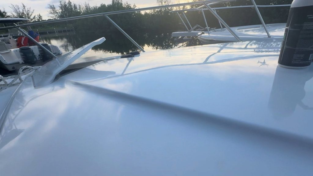 White topside reflecting evening light at the dock